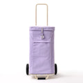  The front view of a lilac Joyrolla Cart, showcasing its vibrant and attractive color. The cart is captured from the front, displaying its sturdy frame and spacious storage bag. The lilac hue adds a touch of elegance and playfulness to the cart's appearance. This Joyrolla Cart offers a practical and stylish solution for transporting items with ease, whether it's for grocery shopping, travel, or everyday use.