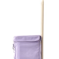 A close up of the lilac Joyrolla Cart featuring its tall and sleek handle and 100% recycled polyester canvas fabric.
