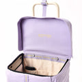 A detailed photo of the Joyrolla Cart with a lilac bag, showcasing its internal pockets and functional features. The cart's lilac bag and internal beige lining is visible, featuring multiple internal pockets for organizing items. One pocket holds a phone securely and the other can hold reusable bags, laptop or fresh produce. The lid of the cart is being held up by a handy strap, allowing easy access to the contents inside
